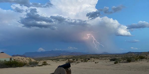 Late summer storm clouds with lightning over the Chisos Mountains
