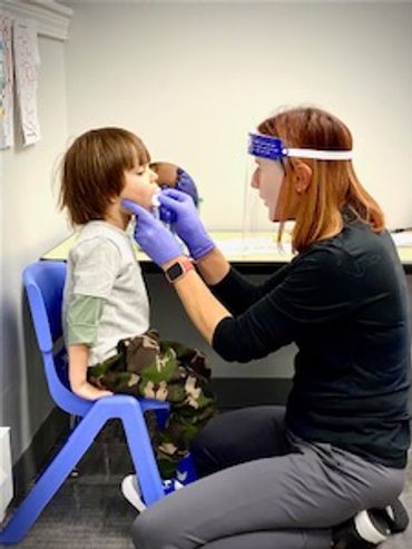 Focusing on tongue-jaw dissociation and tongue retraction with elevation for speech sounds.