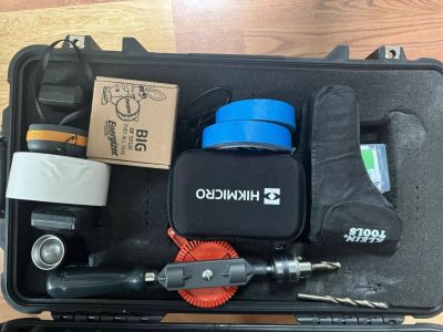 Open tool case with various tools and supplies.