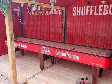 Vinyl Printing for Custom Branded Shuffle Board Table Rentals from Castle Party Planning Chicago.