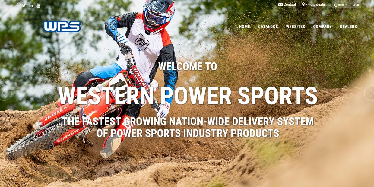 Motocross rider kicking up dirt on a track with Western Power Sports branding.