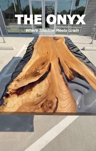 Wood and resin table named The Onyx with natural grain and shadow design.