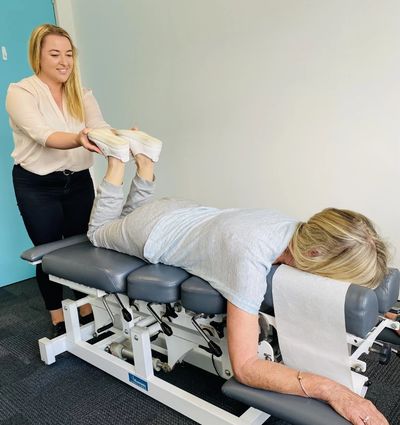 Chiropractor Dr Jennifer during a thorough examination of a patient during initial appointment