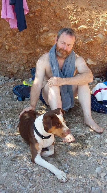Reiki and Pets. Martin treats a dog on the beach