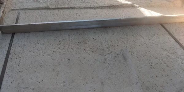 laying concrete pavers, screeding paving sand, Paving contractors Northern Adelaide