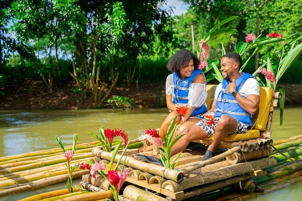 Couple enjoying bamboo rafting
