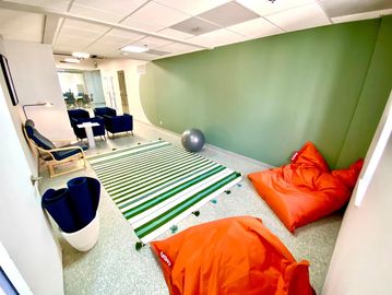 mindwarehouse office space for rent with orange bean bags and yoga ball