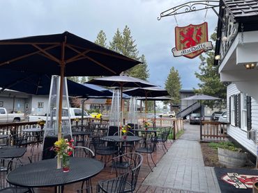 Outdoors patio dining area with umbrellas