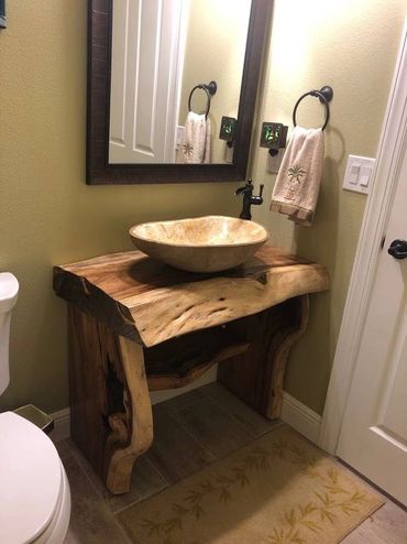 Rustic modern custom live edge vanity with live edge legs and towel shelf. Inspired by luxe resort t