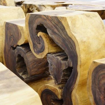 Live edge log console art sculptures lined up and ready for purchase