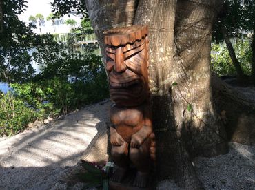 4 foot tall Tiki god carving in outdoor scene on TV Show Insane Pools filmed on Siesta Key Season 1