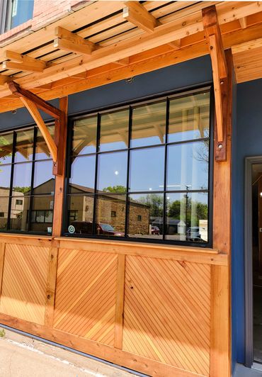 Custom-designed wooden storefront and awning.