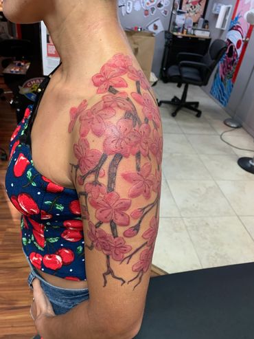 Cherry blossom tattoo on arm.