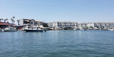 Cruising in the Newport Harbor on the Big Bamboo, TikiFunBoats boat rental