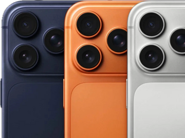 Three smartphones in navy, orange, and silver colors showing rear cameras.