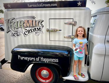 Little girl with Karmic 1958 Ice Cream truck