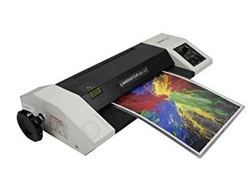 A laminator machine laminating a colorful printed sheet.