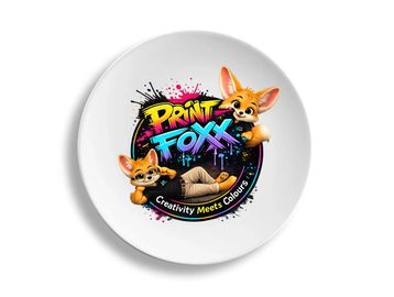 Cute fox mascots with colorful graffiti text on a white plate.