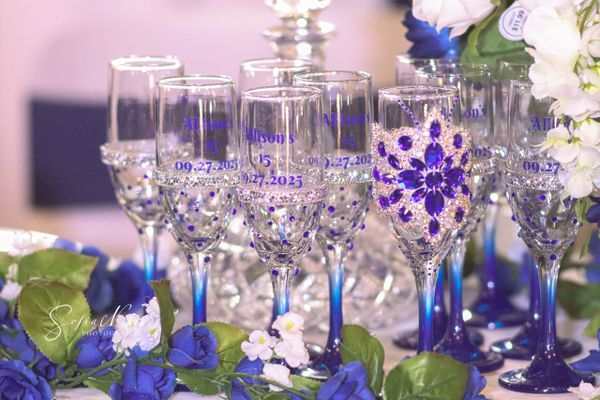 Elegant decorated champagne glasses for Allison's 15th birthday celebration.