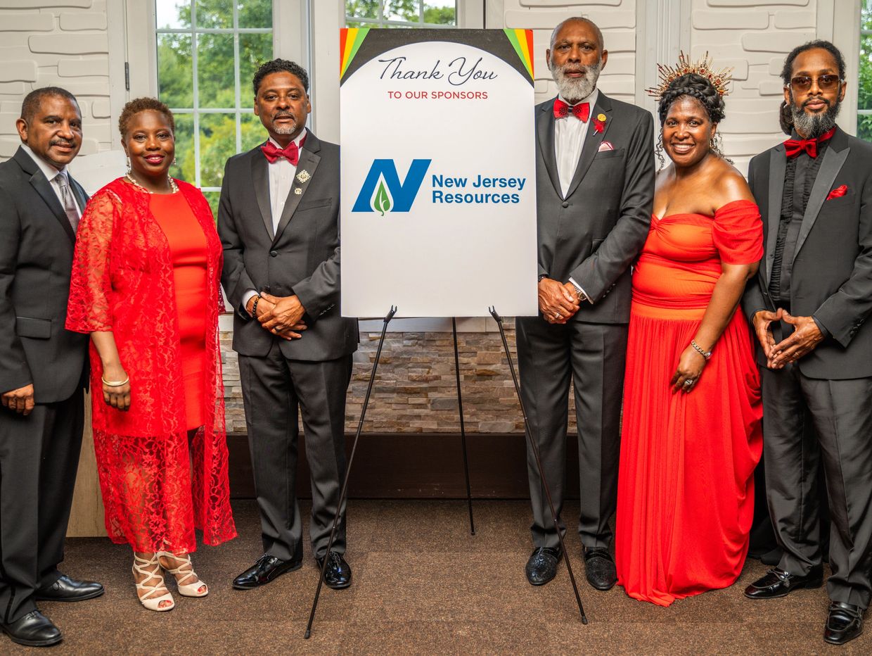 Monmouth County Diversity Alliance board members, standing next to an easel thanking our sponsors