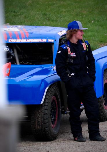 Travis JR in Front of the truck ready to race