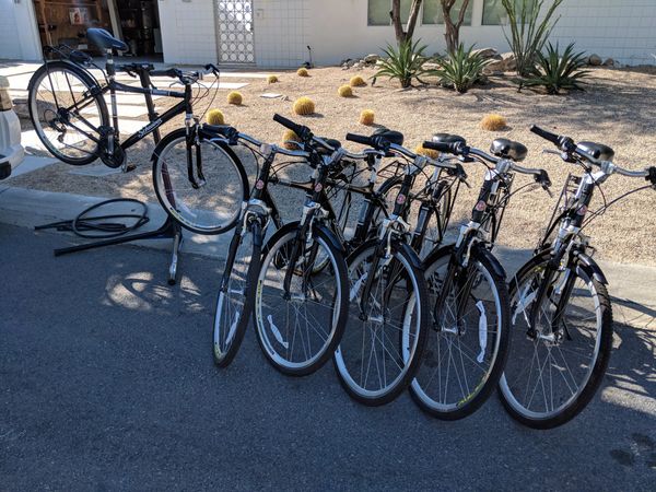 Six bicycles arranged in a neat row.