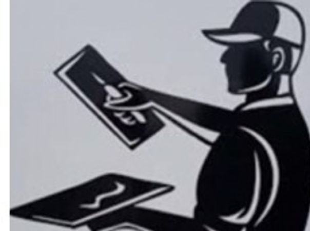 Silhouette of a person holding two items, wearing a cap.
