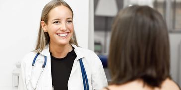 OB doctor talking to her patient in San Fernando, CA