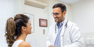 OB Doctor talking to his patient in San Fernando, CA