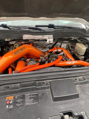 Orange powder coated performance parts.