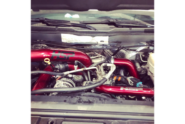 Maroon highlighted powder coated diesel performance parts.