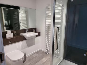 En-suite shower room luxury apartment.