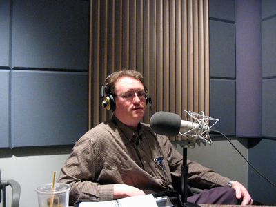 Stephen M. Vantassel in a radio studio discussing wildlife control and animal rights issues.