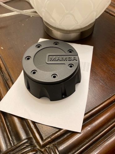 3D printed wheel hub cover for a Jeep