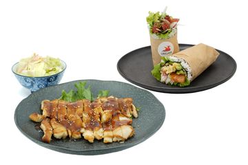 Grilled chicken, salad, and a fresh wrap served on separate plates.
