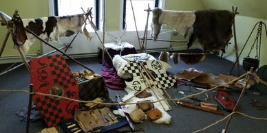 An indoor Living History display of materials.