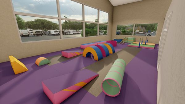Colorful indoor obstacle course for children with soft play equipment.