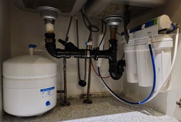 Under-sink Pentair reverse osmosis system with storage tank installed by Pure Life H2O
