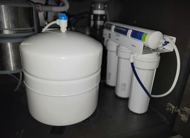 Under-sink Pentair reverse osmosis system with storage tank installed by Pure Life H2O