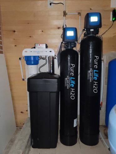 Whole-home well water treatment system with iron removal, water softener and filtration.