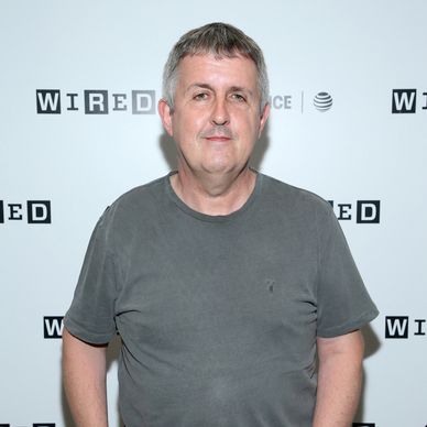 A man posing at a Wired event with a neutral expression.