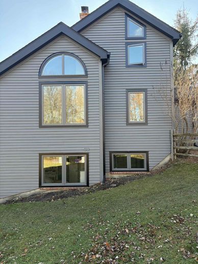 Custom-shaped windows installed in Simcoe County — unique designs and natural light.