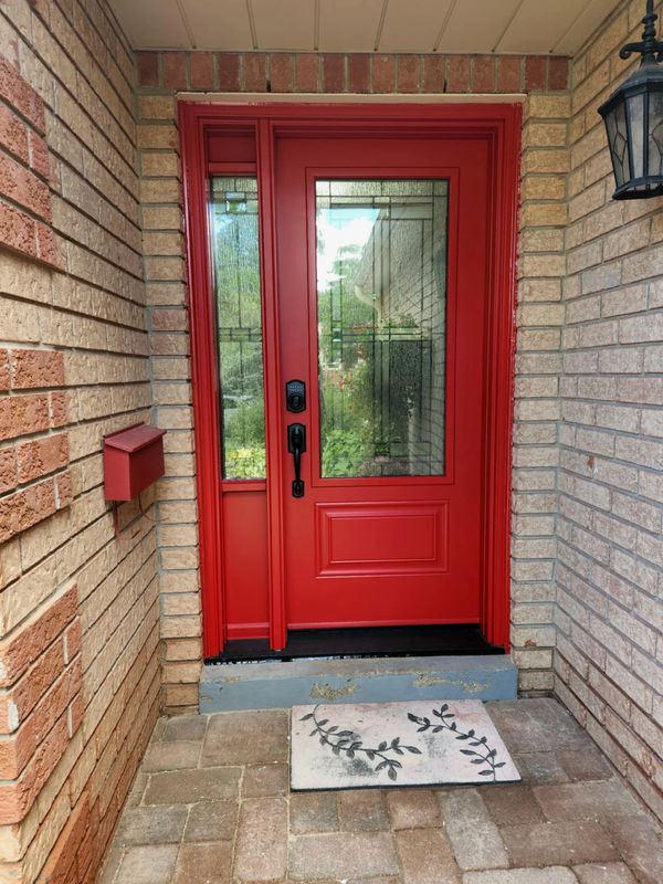 Front door with sidelights installed by Bros Windows & Doors in Simcoe County — modern home entrance