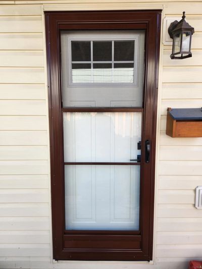 Full-view glass storm door installation — durable protection with a clean, modern look