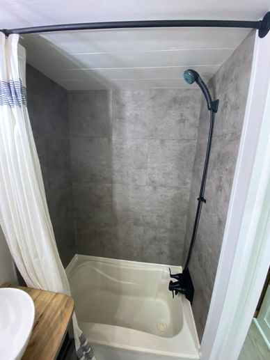 You can replace old yellowed tub and shower surrounds with Dumawall Vinyl click and lock tile.