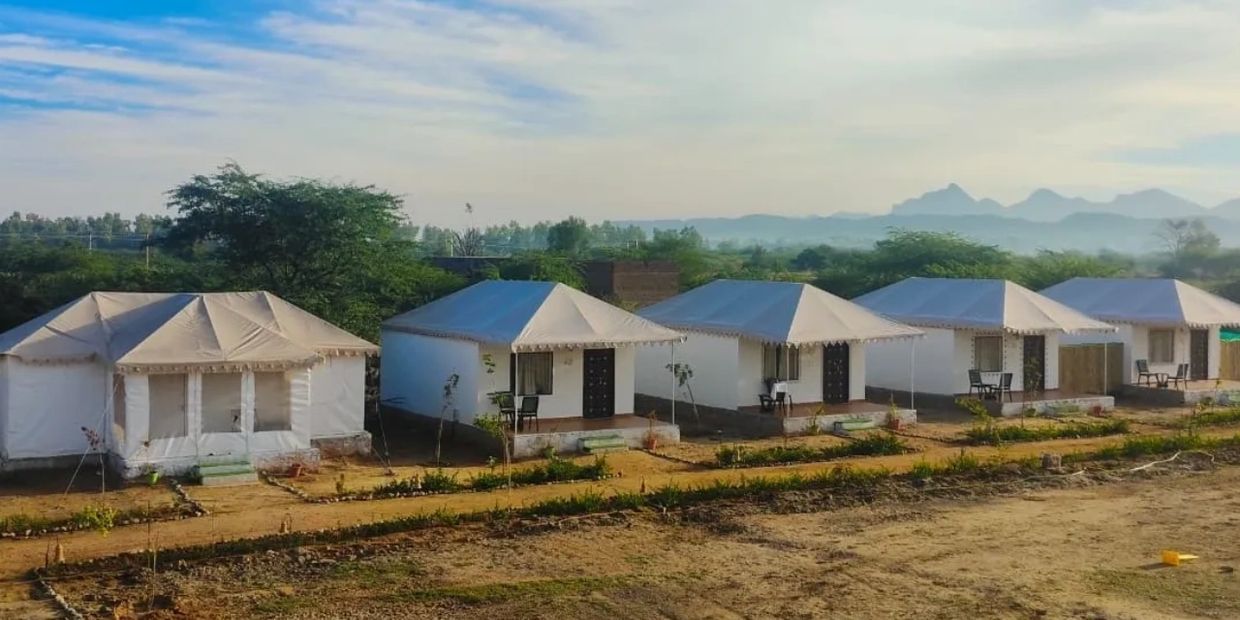 Enjoy a luxurious tent and cottage stay at Jawai Leopard Den Resort, complete with your own jeep for leopard safari, budget-friendly accommodation, delicious Rajasthani food, and a refreshing swimming pool for the perfect wildlife getaway.