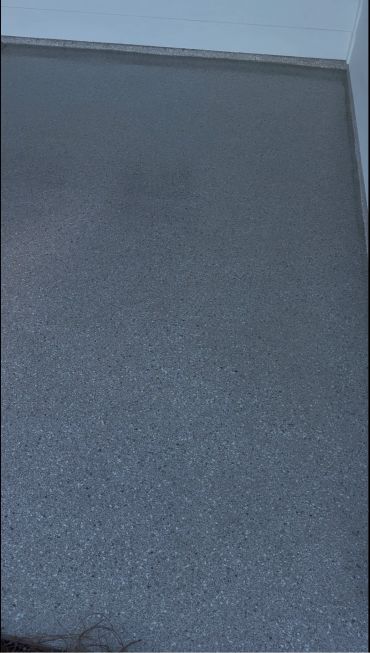 Smooth gray textured floor surface.