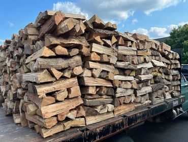 Firewood stacked on truck.