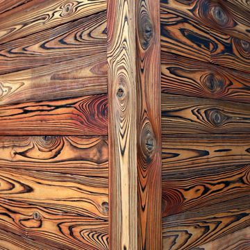 Close-up of a corner with beautifully patterned wooden planks.
