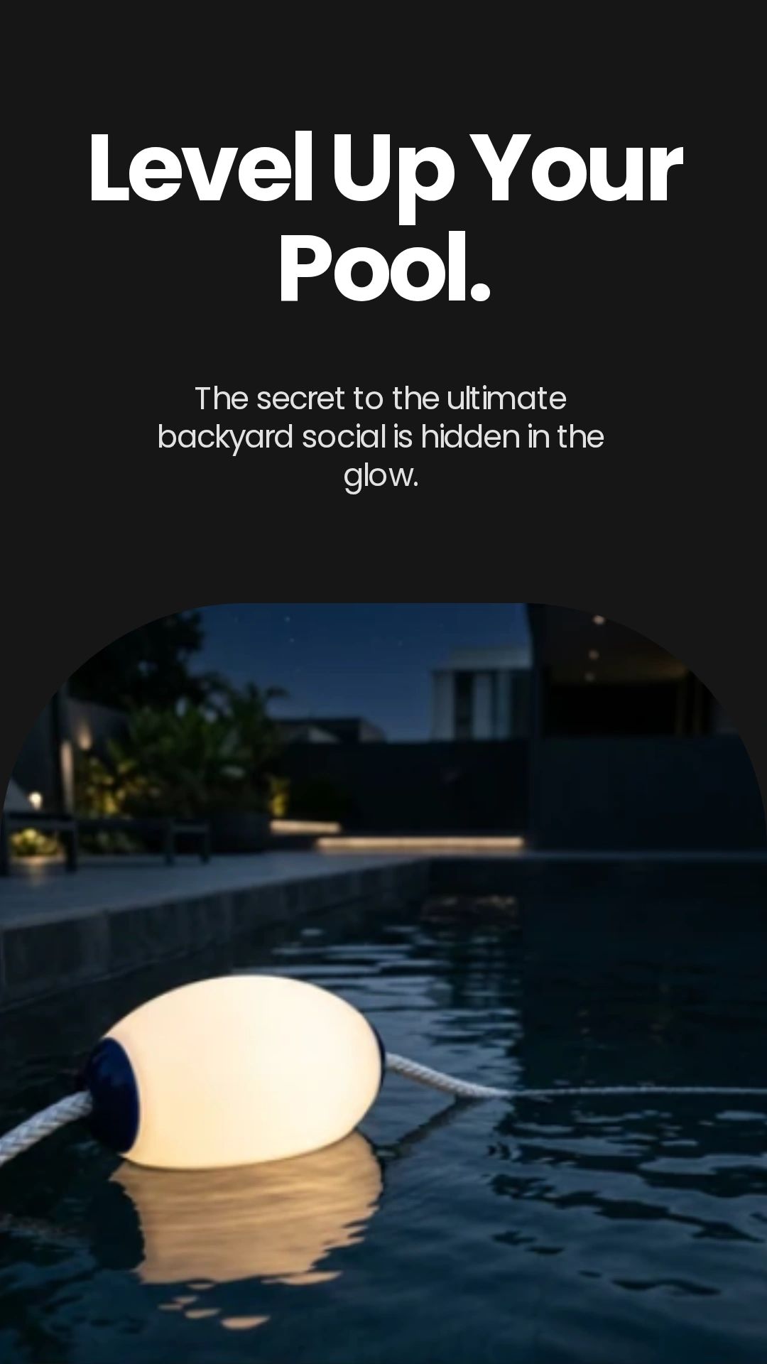 Glowing pool light enhancing a backyard nighttime ambiance.